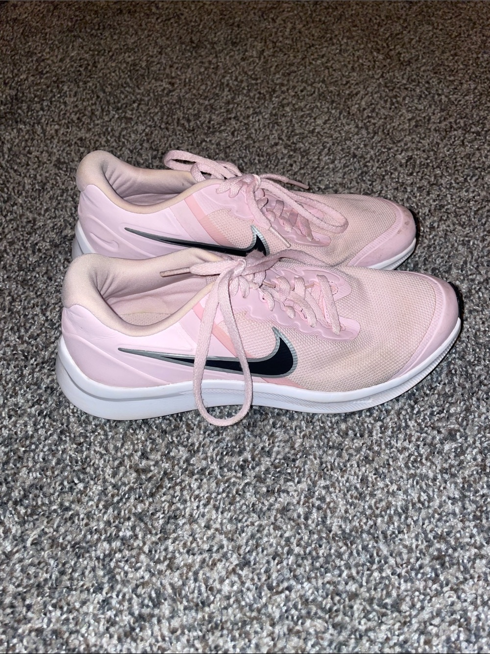 Nike Women's Light Pink Athletic Running Shoes with Black Swoosh